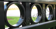 Ornamental Circle Option Installed Between Black Aluminum Picket