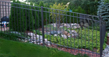 Black San Marino Aluminum Fence Installed on Sloped Terrain