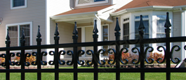 Castile Industrial Fence With Decorative Butterfly Scrolls and Finials