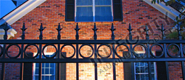 Providence Residential Aluminum Fence Installed In Front Of a Brick Home